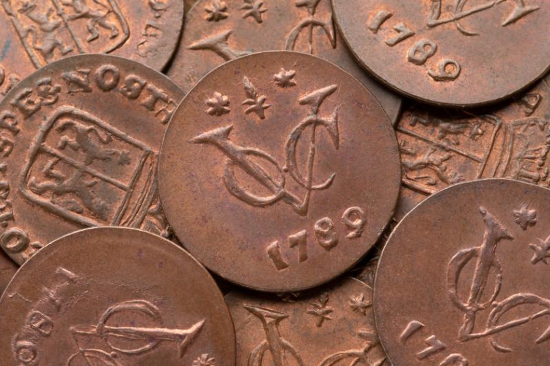 A close-up collection of historic Dutch East India Company (VOC) copper coins from 1789 recovered from coastal shipwrecks and exhibited at the Shipwreck Museum on Independent Street, Bredasdorp.